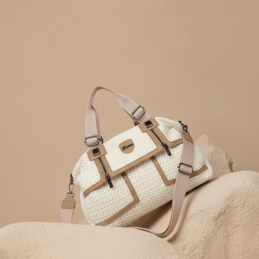 White textured handbag with beige straps on a beige background